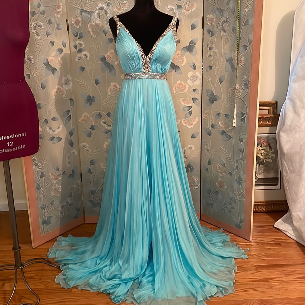 Sherri Hill 100 % Silk Turquoise gown with abs crystals detailing .